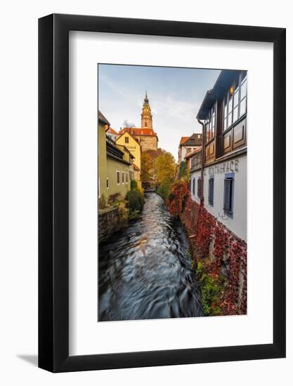 Looking down canal to Castle Tower in Cesky Krumlov, Czech Republic-Chuck Haney-Framed Photographic Print