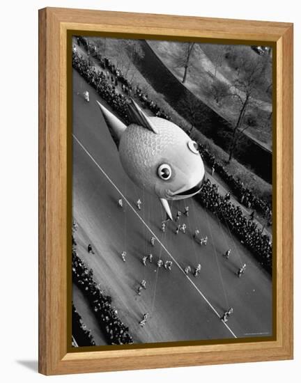 Looking Down Onto Fish Balloon and Crowds Lining Street During Macy's Thanksgiving Day Parade-John Phillips-Framed Premier Image Canvas