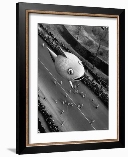 Looking Down Onto Fish Balloon and Crowds Lining Street During Macy's Thanksgiving Day Parade-John Phillips-Framed Premium Photographic Print