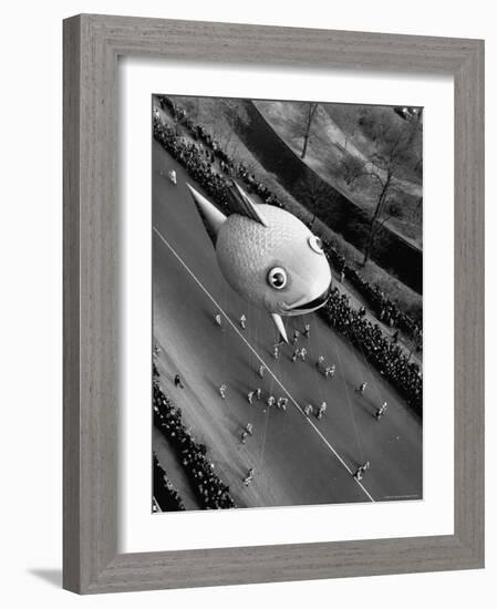 Looking Down Onto Fish Balloon and Crowds Lining Street During Macy's Thanksgiving Day Parade-John Phillips-Framed Photographic Print