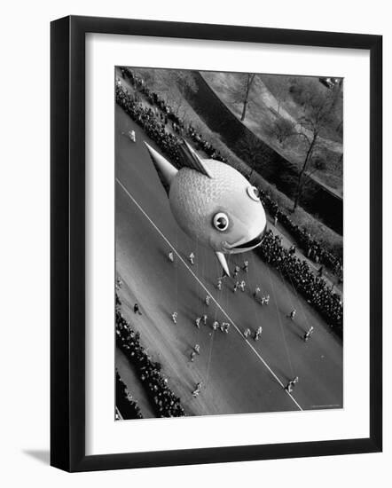 Looking Down Onto Fish Balloon and Crowds Lining Street During Macy's Thanksgiving Day Parade-John Phillips-Framed Photographic Print