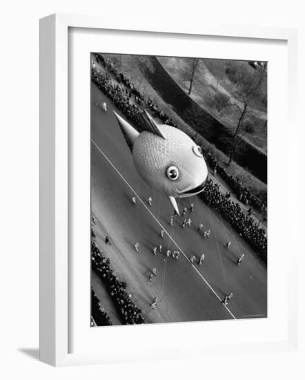 Looking Down Onto Fish Balloon and Crowds Lining Street During Macy's Thanksgiving Day Parade-John Phillips-Framed Photographic Print