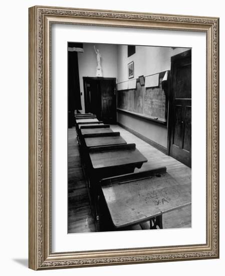 Looking Down Row of Empty Scarred Old Fashioned Desks in Schoolroom-Walter Sanders-Framed Photographic Print