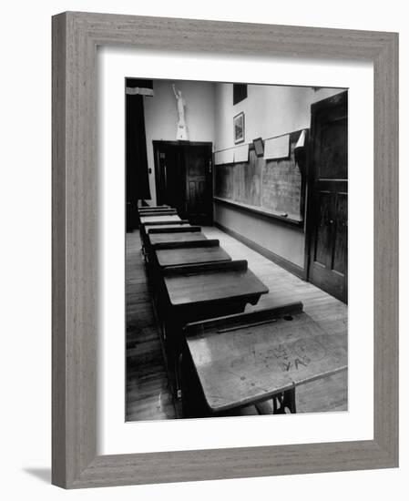 Looking Down Row of Empty Scarred Old Fashioned Desks in Schoolroom-Walter Sanders-Framed Photographic Print