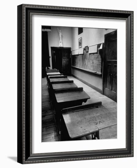 Looking Down Row of Empty Scarred Old Fashioned Desks in Schoolroom-Walter Sanders-Framed Photographic Print