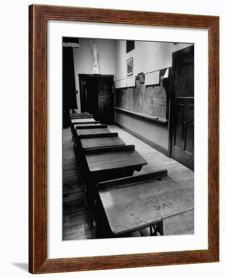 Looking Down Row of Empty Scarred Old Fashioned Desks in Schoolroom-Walter Sanders-Framed Photographic Print