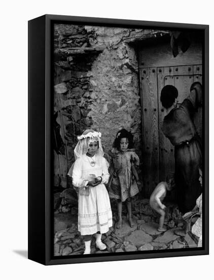 Lorenza Curiel in White First Communion Dress Waiting for Mother to Lock Door-W^ Eugene Smith-Framed Premier Image Canvas