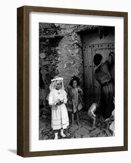 Lorenza Curiel in White First Communion Dress Waiting for Mother to Lock Door-W^ Eugene Smith-Framed Photographic Print