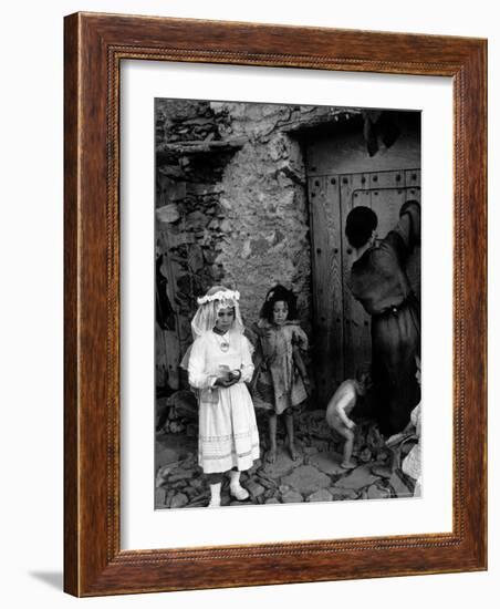 Lorenza Curiel in White First Communion Dress Waiting for Mother to Lock Door-W^ Eugene Smith-Framed Photographic Print