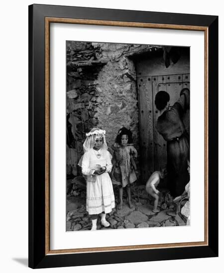 Lorenza Curiel in White First Communion Dress Waiting for Mother to Lock Door-W^ Eugene Smith-Framed Photographic Print