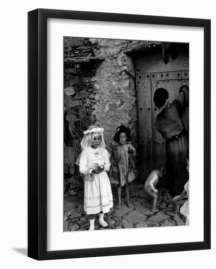 Lorenza Curiel in White First Communion Dress Waiting for Mother to Lock Door-W^ Eugene Smith-Framed Photographic Print