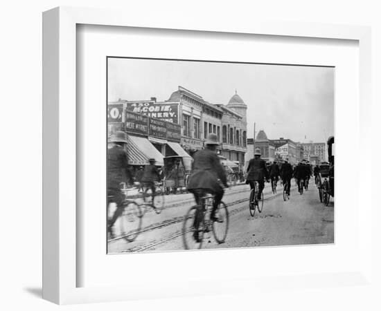 Los Angeles Police Officers Bicycling Past Broadway Storefronts-null-Framed Photographic Print