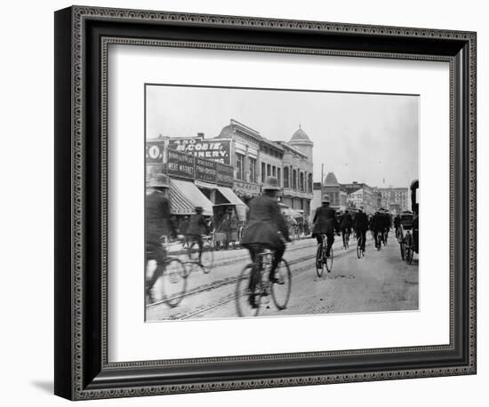 Los Angeles Police Officers Bicycling Past Broadway Storefronts-null-Framed Photographic Print