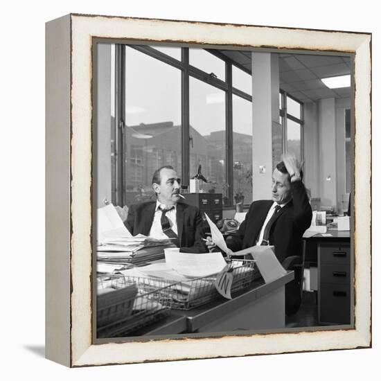 Lost Order? Two Salesmen Try to Sort Out the Orders over a Cigarette, 1967-Michael Walters-Framed Premier Image Canvas