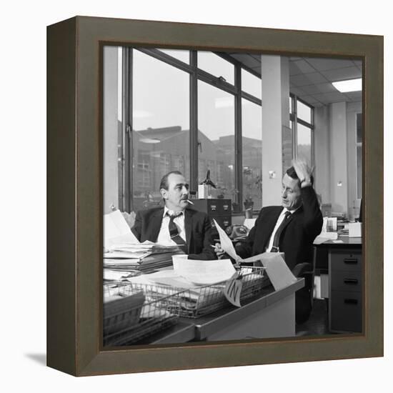 Lost Order? Two Salesmen Try to Sort Out the Orders over a Cigarette, 1967-Michael Walters-Framed Premier Image Canvas