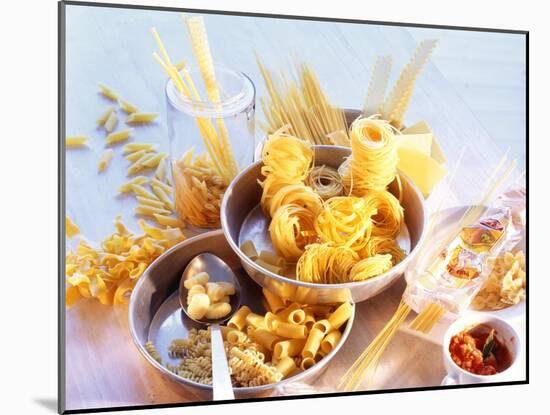 Lots of Different Types of Pasta in Dishes, Tomato Sauce-Ulrike Holsten-Mounted Photographic Print
