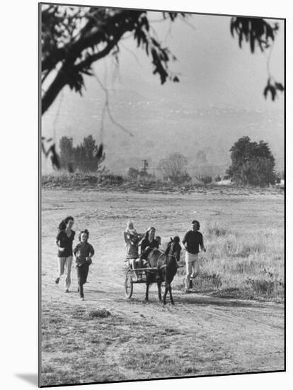 Louie Elias and Family, Riding in Their Pony Cart-Michael Rougier-Mounted Premium Photographic Print