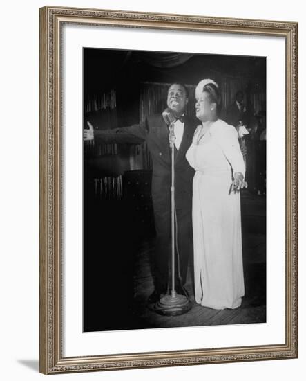Louis Armstrong and Vocalist Performing in Floor Show at Cafe Zanzibar-Alfred Eisenstaedt-Framed Premium Photographic Print