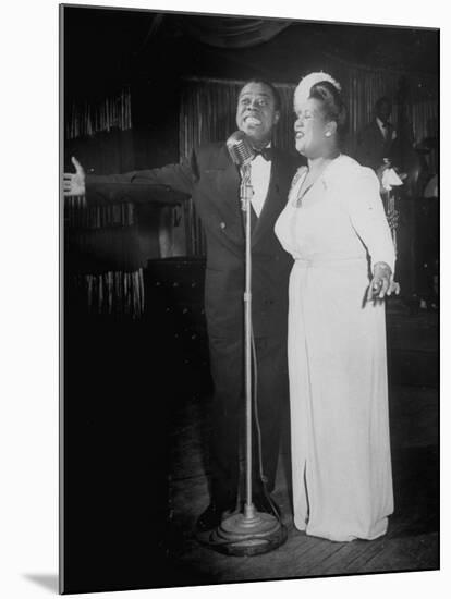 Louis Armstrong and Vocalist Performing in Floor Show at Cafe Zanzibar-Alfred Eisenstaedt-Mounted Premium Photographic Print