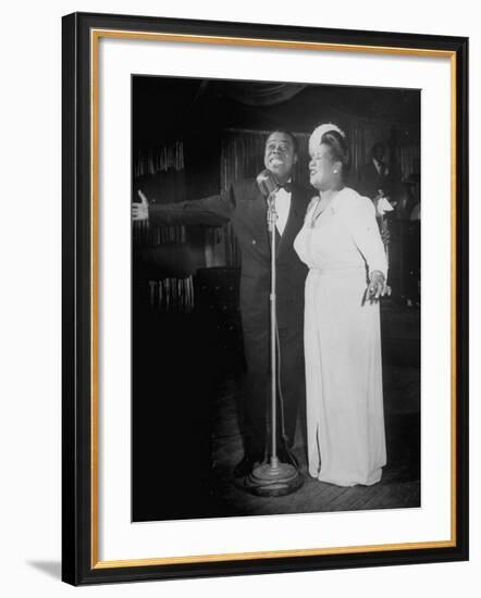 Louis Armstrong and Vocalist Performing in Floor Show at Cafe Zanzibar-Alfred Eisenstaedt-Framed Premium Photographic Print