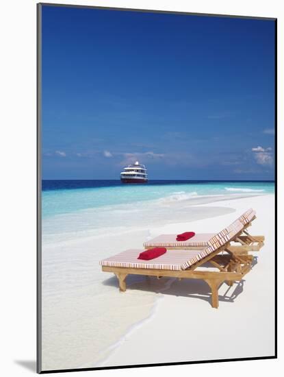 Lounge Chairs on Beach and Yacht, Maldives, Indian Ocean, Asia-Sakis Papadopoulos-Mounted Photographic Print