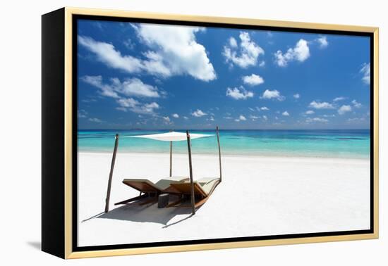 Lounge chairs on tropical white sandy beach, The Maldives, Indian Ocean, Asia-Sakis Papadopoulos-Framed Premier Image Canvas