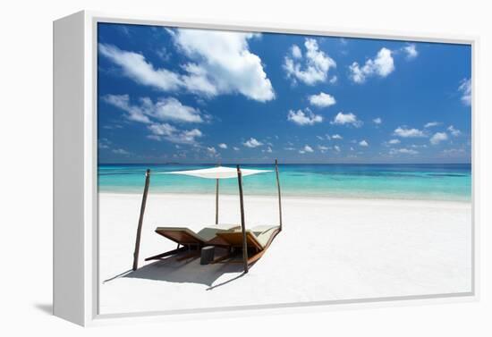 Lounge chairs on tropical white sandy beach, The Maldives, Indian Ocean, Asia-Sakis Papadopoulos-Framed Premier Image Canvas