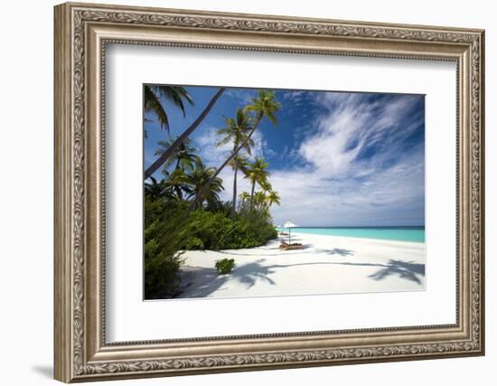 Lounge chairs under shade of umbrella on tropical beach, Maldives, Indian Ocean, Asia-Sakis Papadopoulos-Framed Photographic Print