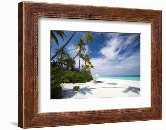 Lounge chairs under shade of umbrella on tropical beach, Maldives, Indian Ocean, Asia-Sakis Papadopoulos-Framed Photographic Print