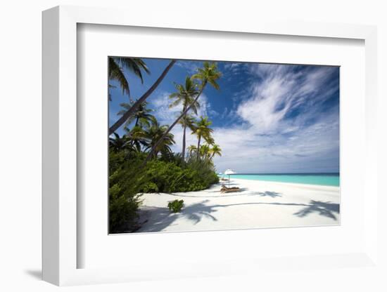 Lounge chairs under shade of umbrella on tropical beach, Maldives, Indian Ocean, Asia-Sakis Papadopoulos-Framed Photographic Print