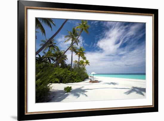 Lounge chairs under shade of umbrella on tropical beach, Maldives, Indian Ocean, Asia-Sakis Papadopoulos-Framed Photographic Print