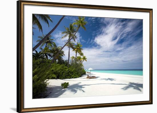 Lounge chairs under shade of umbrella on tropical beach, Maldives, Indian Ocean, Asia-Sakis Papadopoulos-Framed Photographic Print