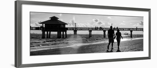 Loving Couple walking along the Beach at Sunset-Philippe Hugonnard-Framed Photographic Print