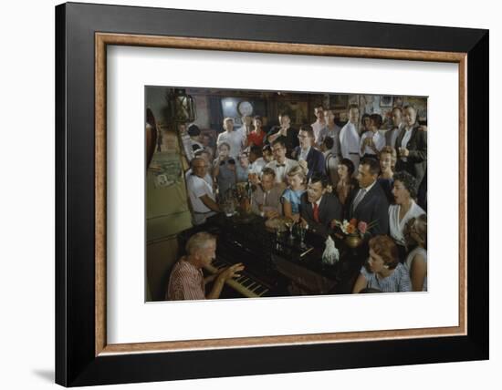 Low-Angle View of a Group of People as They Sing Along with a Pianist in a Unidentified Bar, 1959-Yale Joel-Framed Photographic Print