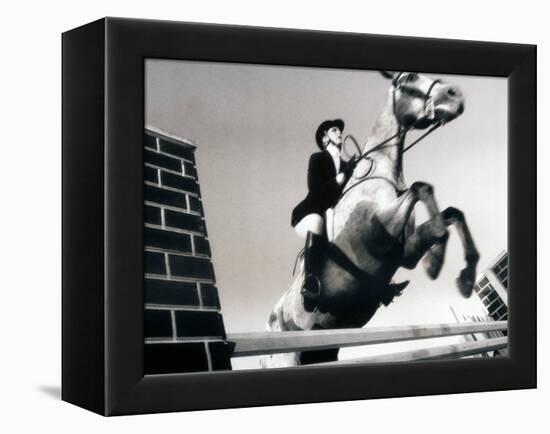 Low Angle View of a Jockey And a Horse Jumping Over a Hurdle-null-Framed Premier Image Canvas