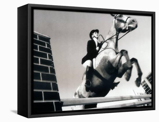 Low Angle View of a Jockey And a Horse Jumping Over a Hurdle-null-Framed Premier Image Canvas