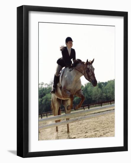 Low Angle View of a Jockey And a Horse Jumping Over a Hurdle-null-Framed Photographic Print