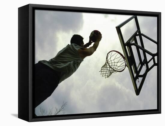 Low Angle View of a Man Shooting a Basket-null-Framed Premier Image Canvas