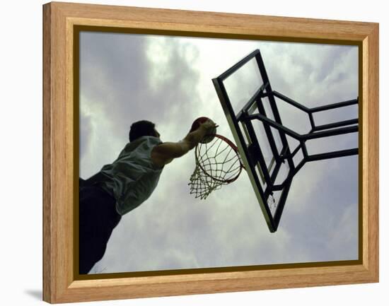 Low Angle View of a Man Shooting a Basket-null-Framed Premier Image Canvas