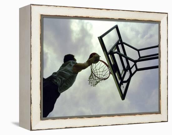 Low Angle View of a Man Shooting a Basket-null-Framed Premier Image Canvas