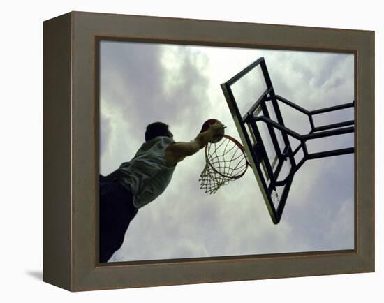 Low Angle View of a Man Shooting a Basket-null-Framed Premier Image Canvas