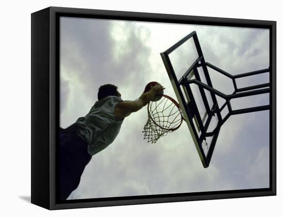 Low Angle View of a Man Shooting a Basket-null-Framed Premier Image Canvas