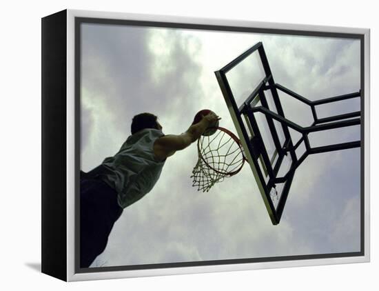Low Angle View of a Man Shooting a Basket-null-Framed Premier Image Canvas