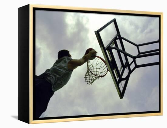 Low Angle View of a Man Shooting a Basket-null-Framed Premier Image Canvas