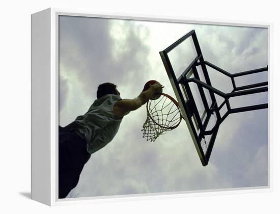 Low Angle View of a Man Shooting a Basket-null-Framed Premier Image Canvas