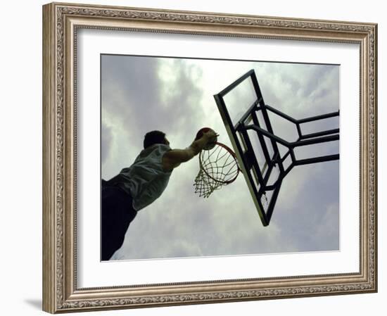 Low Angle View of a Man Shooting a Basket-null-Framed Photographic Print