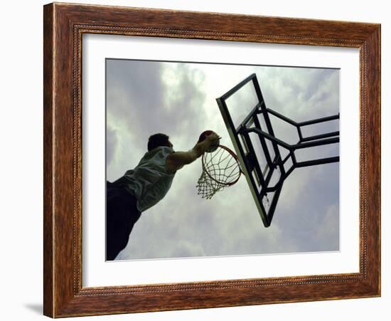 Low Angle View of a Man Shooting a Basket-null-Framed Photographic Print