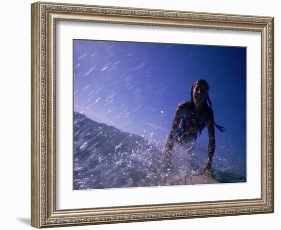 Low Angle View of a Teenage Girl Riding a Surfboard-George Silk-Framed Photographic Print