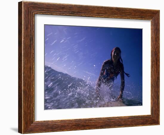 Low Angle View of a Teenage Girl Riding a Surfboard-George Silk-Framed Photographic Print