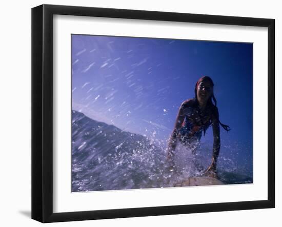 Low Angle View of a Teenage Girl Riding a Surfboard-George Silk-Framed Photographic Print